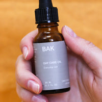 BAK Daily oil with prebiotics, probiotics, Sweet Almond & Jojoba oils, and Vitamin E